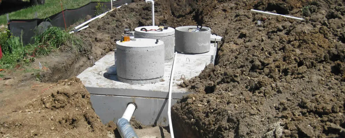 Septic system repair and installation site with tank access ports in Aurora, CO